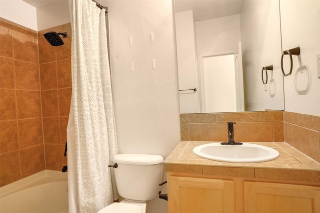 full bathroom with toilet, shower / bath combo with shower curtain, and vanity