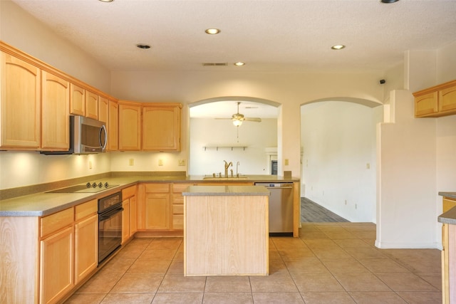 kitchen with arched walkways, a sink, a ceiling fan, light brown cabinetry, and black appliances