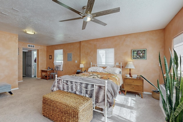 carpeted bedroom featuring visible vents, ceiling fan, a textured ceiling, and baseboards