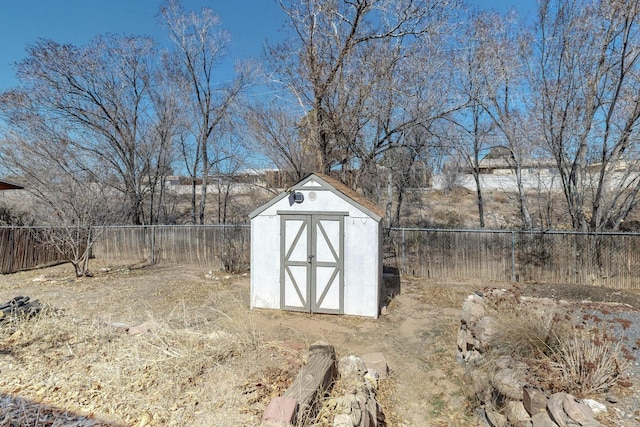 view of shed featuring a fenced backyard