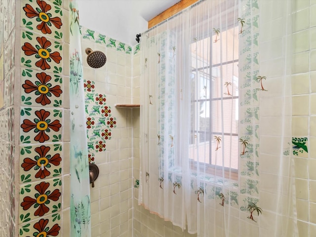 bathroom with a tile shower