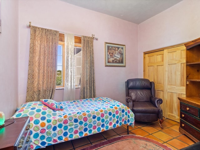 bedroom featuring tile patterned flooring