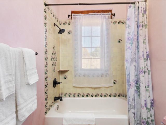 bathroom with shower / bathtub combination with curtain