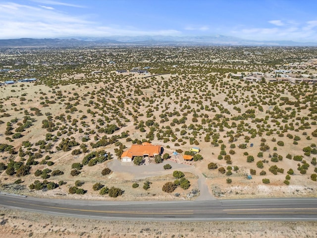 birds eye view of property with a mountain view