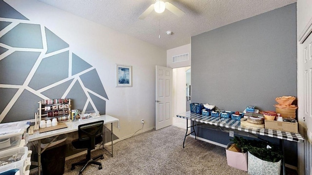 home office with baseboards, visible vents, a ceiling fan, a textured ceiling, and carpet floors