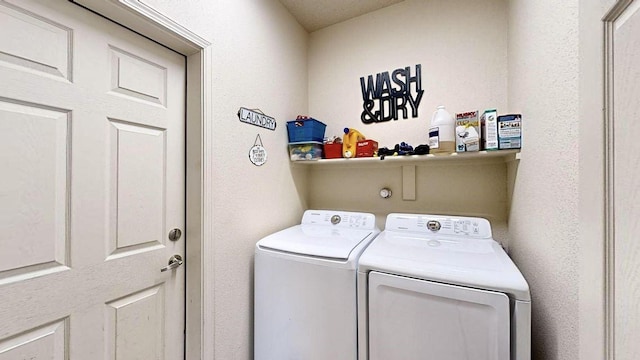 washroom with laundry area and washing machine and clothes dryer