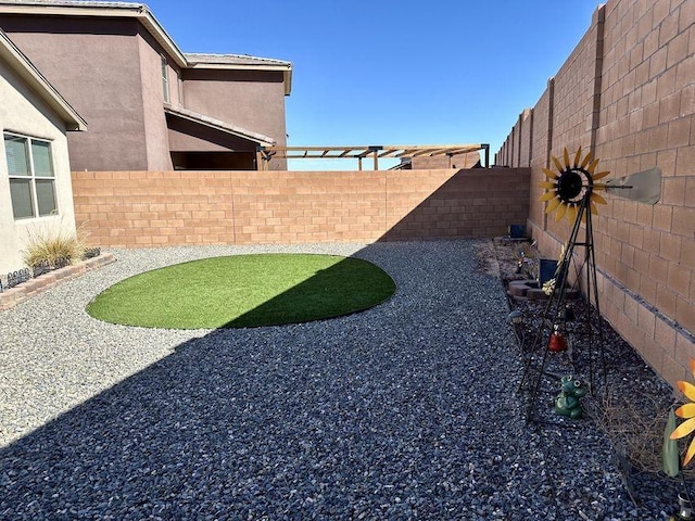 view of yard featuring a fenced backyard