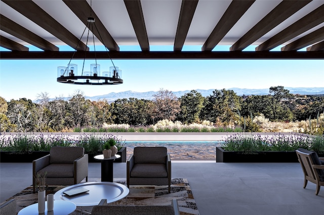 view of patio with a mountain view and a fenced in pool