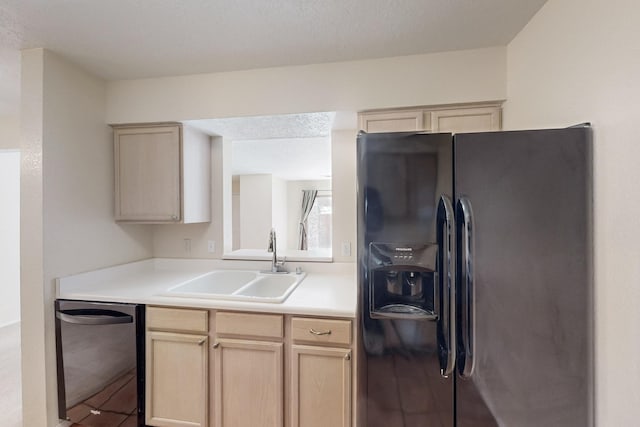 kitchen with dishwasher, light countertops, black refrigerator with ice dispenser, light brown cabinetry, and a sink