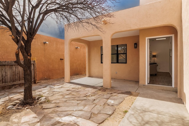 view of patio / terrace featuring fence