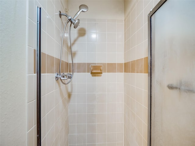 full bath with a shower stall