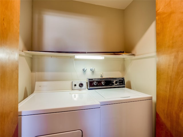 washroom featuring laundry area and washing machine and clothes dryer