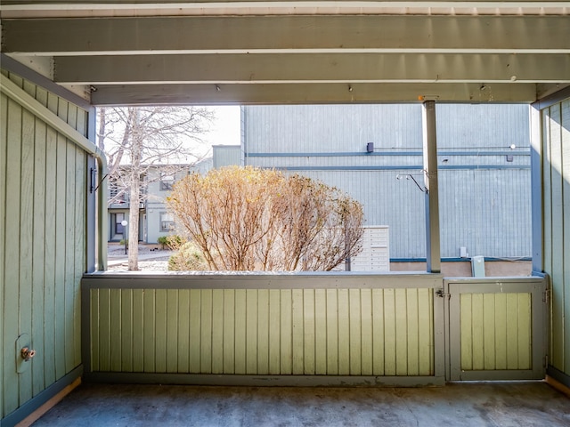 unfurnished sunroom featuring a healthy amount of sunlight