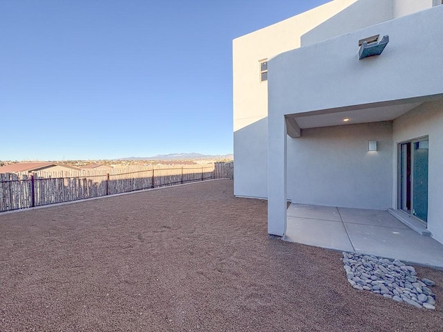 view of yard featuring a fenced backyard and a patio