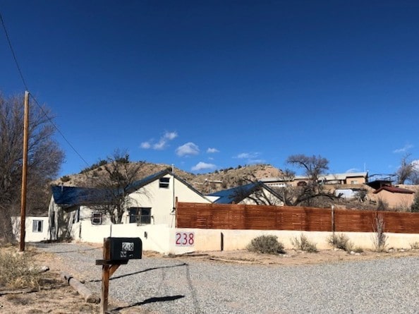 view of property exterior featuring fence