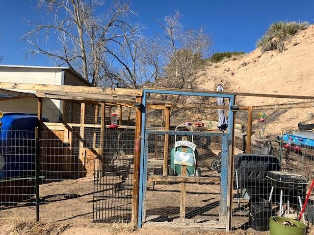 exterior space with an outbuilding and fence