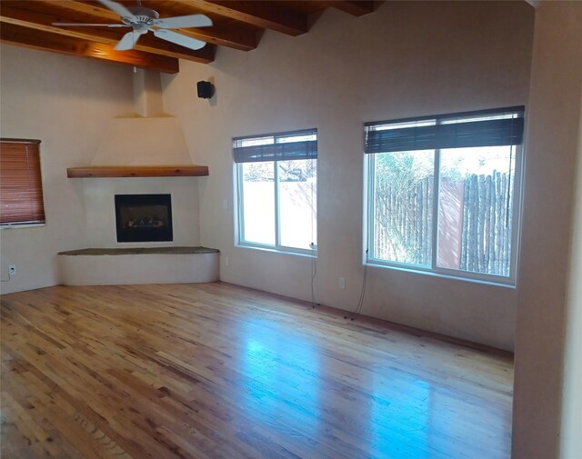 kitchen with decorative backsplash, tile countertops, gas range, and extractor fan