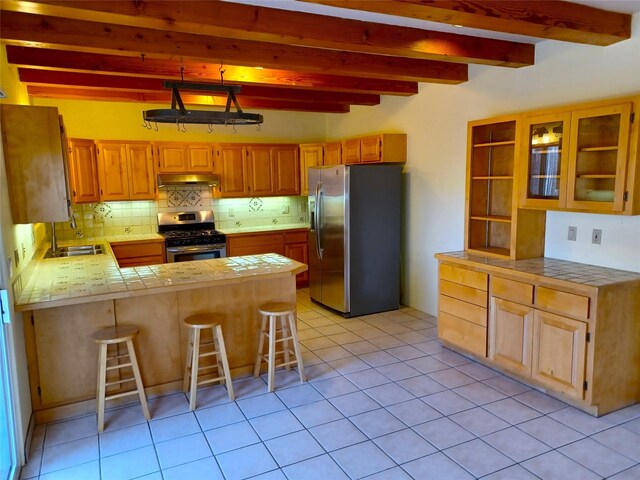 unfurnished living room with a fireplace with raised hearth and wood finished floors