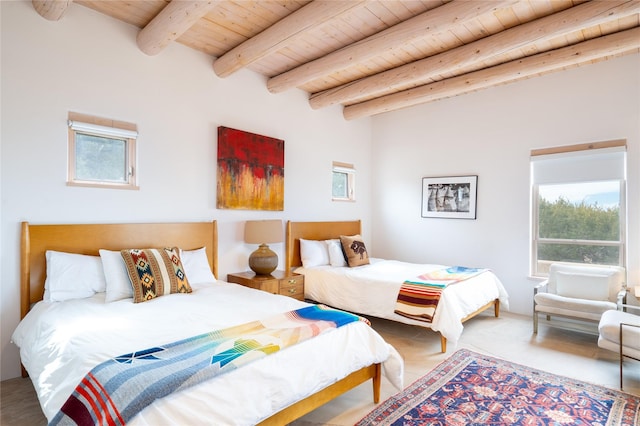 bedroom with beamed ceiling and wooden ceiling