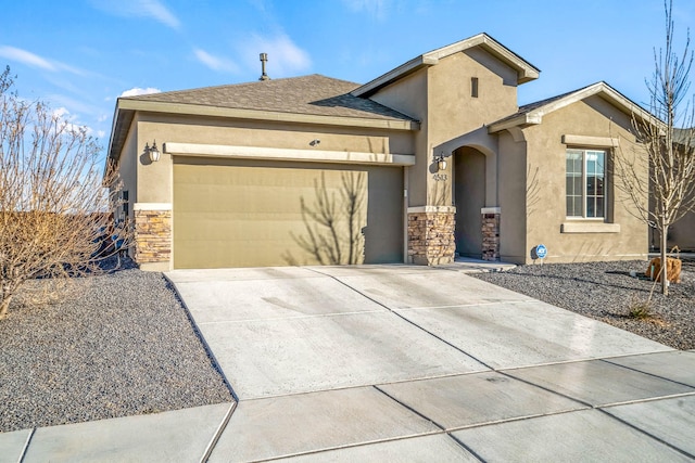 view of front facade featuring concrete driveway, an attached garage, stone siding, and stucco siding