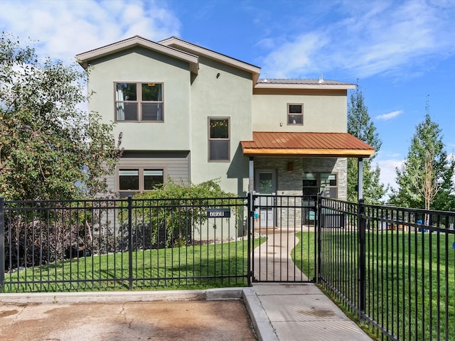 view of front of home featuring a fenced front yard, a front yard, and stucco siding