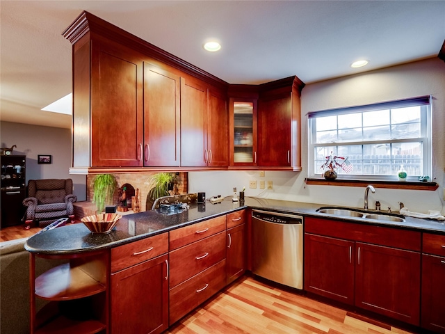 kitchen with recessed lighting, stainless steel dishwasher, light wood-style floors, a sink, and dark brown cabinets