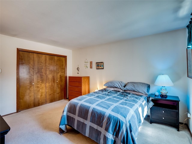 carpeted bedroom with a closet