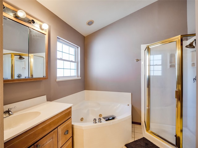 bathroom with tile patterned floors, a jetted tub, vaulted ceiling, vanity, and a shower stall