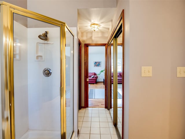 hall featuring light tile patterned flooring