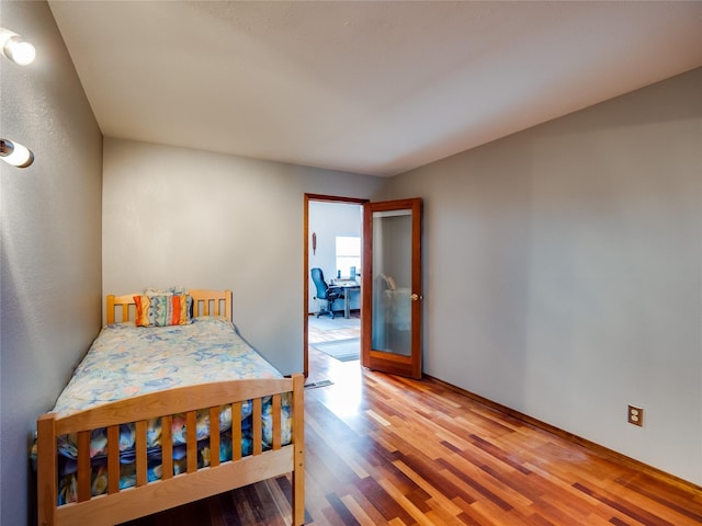 bedroom with wood finished floors