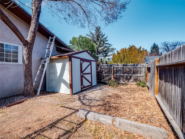 view of shed with a fenced backyard