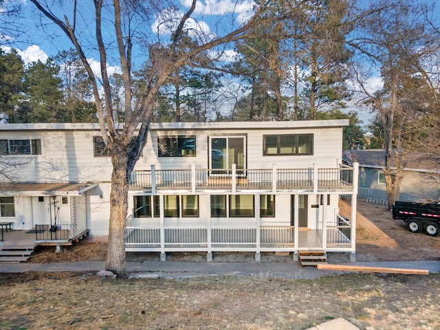 view of front of home featuring a wooden deck