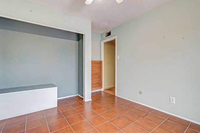 empty room with tile patterned flooring