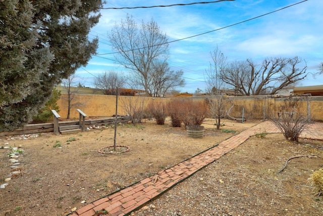 view of yard with a rural view and fence