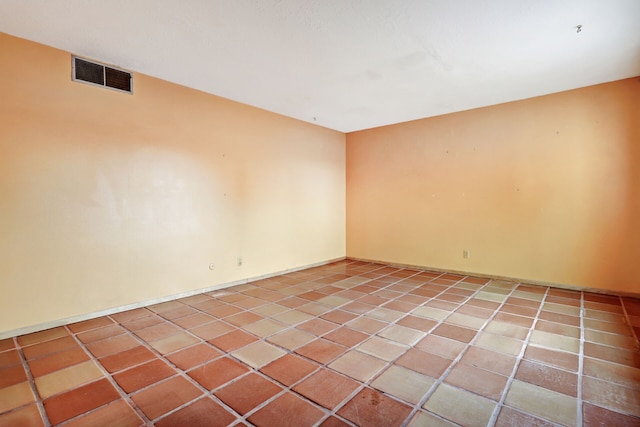 unfurnished room featuring light tile patterned floors and visible vents