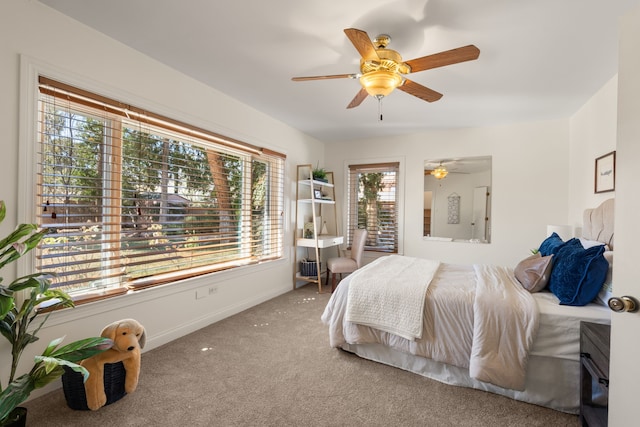 bedroom with baseboards, a ceiling fan, and carpet flooring