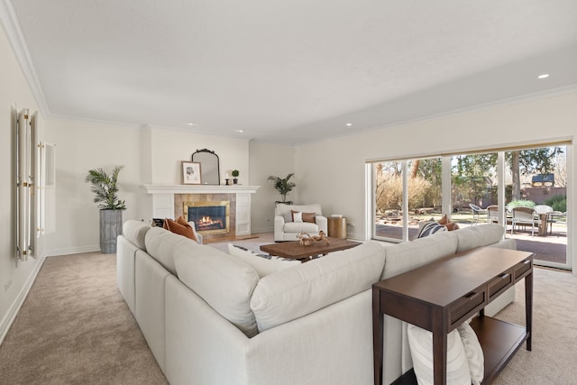 living area featuring a tile fireplace, recessed lighting, light colored carpet, baseboards, and crown molding