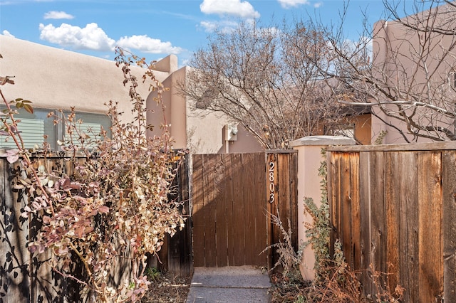 view of yard with fence and a gate