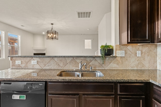 kitchen with black dishwasher, dark brown cabinets, a sink, and visible vents