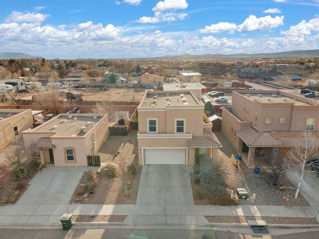 birds eye view of property with a residential view and a mountain view