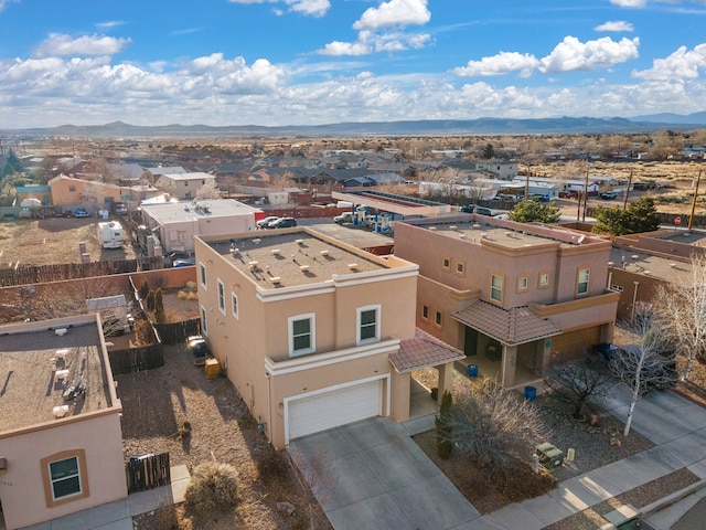 birds eye view of property with a mountain view