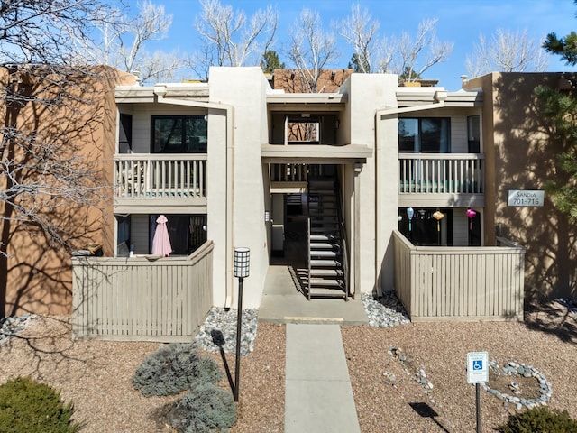 view of property featuring stairway