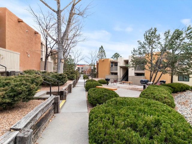 surrounding community featuring a patio area and a residential view