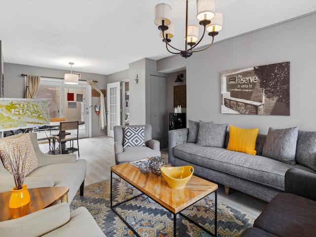 941 Calle Mejia Unit 715, Santa Fe, NM 87501 - living room with wood finished floors, french doors, and a chandelier