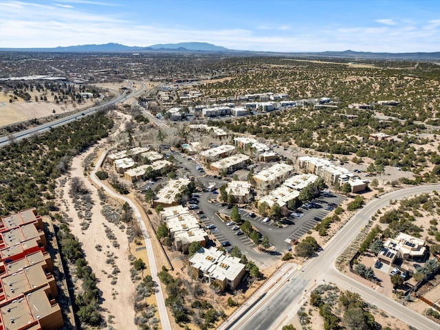 birds eye view of property featuring a mountain view