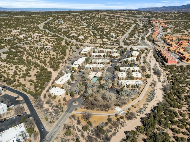 birds eye view of property featuring a mountain view and a desert view