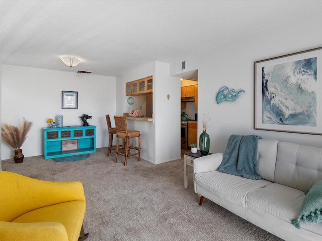 living room featuring visible vents and carpet floors