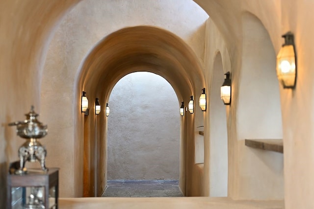 hall featuring arched walkways