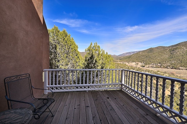 wooden terrace featuring a mountain view