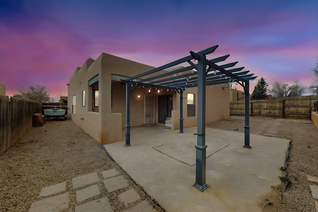 view of patio / terrace featuring a fenced backyard and a pergola